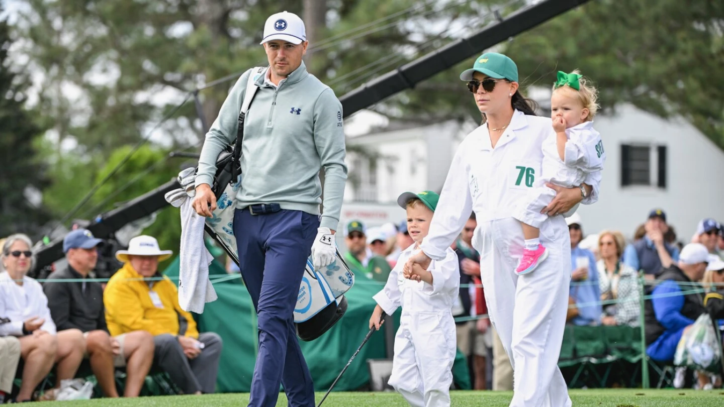 Jordan Spieth celebrating after a major tournament with his family in the crowd